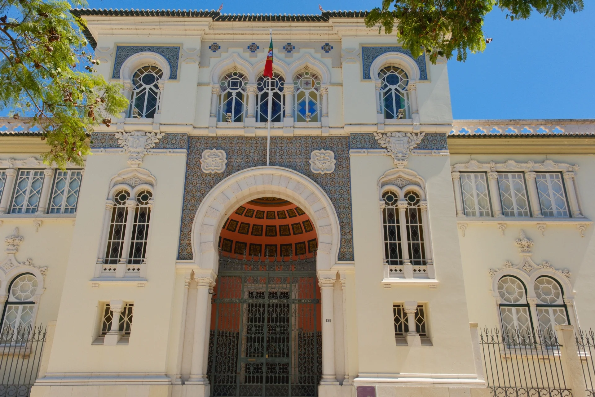 Bank of Portugal building façade in Faro with Neo-Manueline domes and tilework